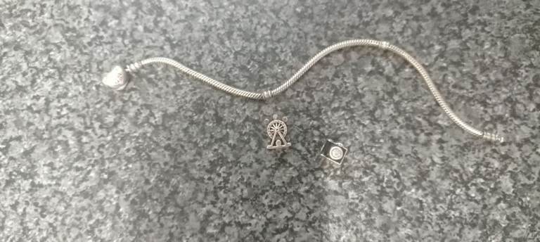 Pandora braclet with 2 charms