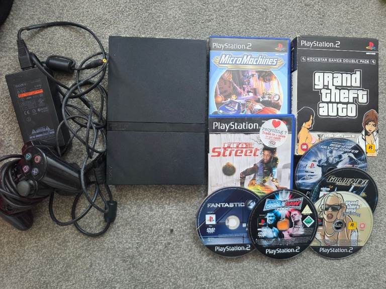 PlayStation 2 Console with Controller and Games – Good Condition