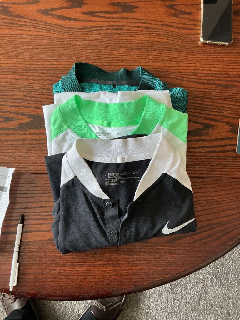 Nike polo shirts and Golf training net.