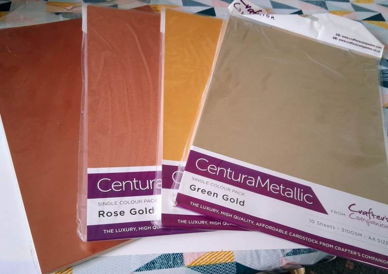  Four A4 Packs of Various Shades of Gold Metallic Card from Crafters Companion.