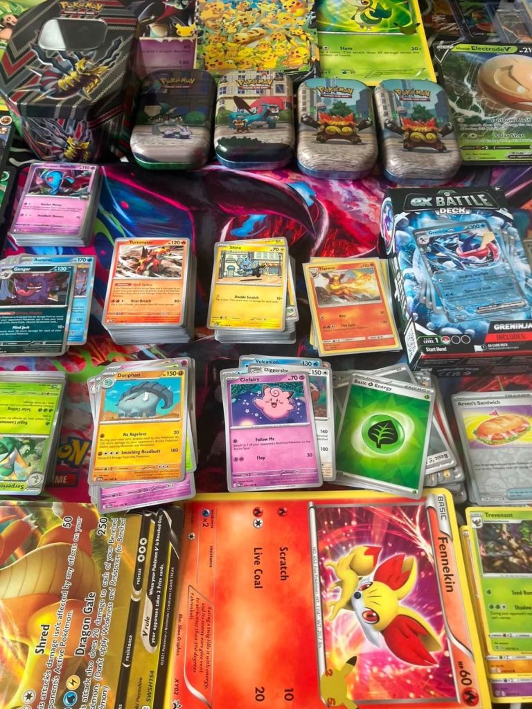 Large Collection of Pokémon Trading Cards and Tins