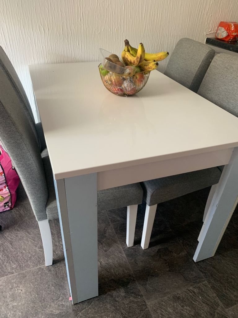 White Dining Table with 4 Grey Chairs – Good Condition