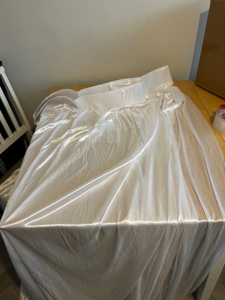 Photo backdrop with white silky sheet