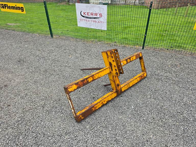 Tractor grays loader bale spike ready for brackets to be welded on