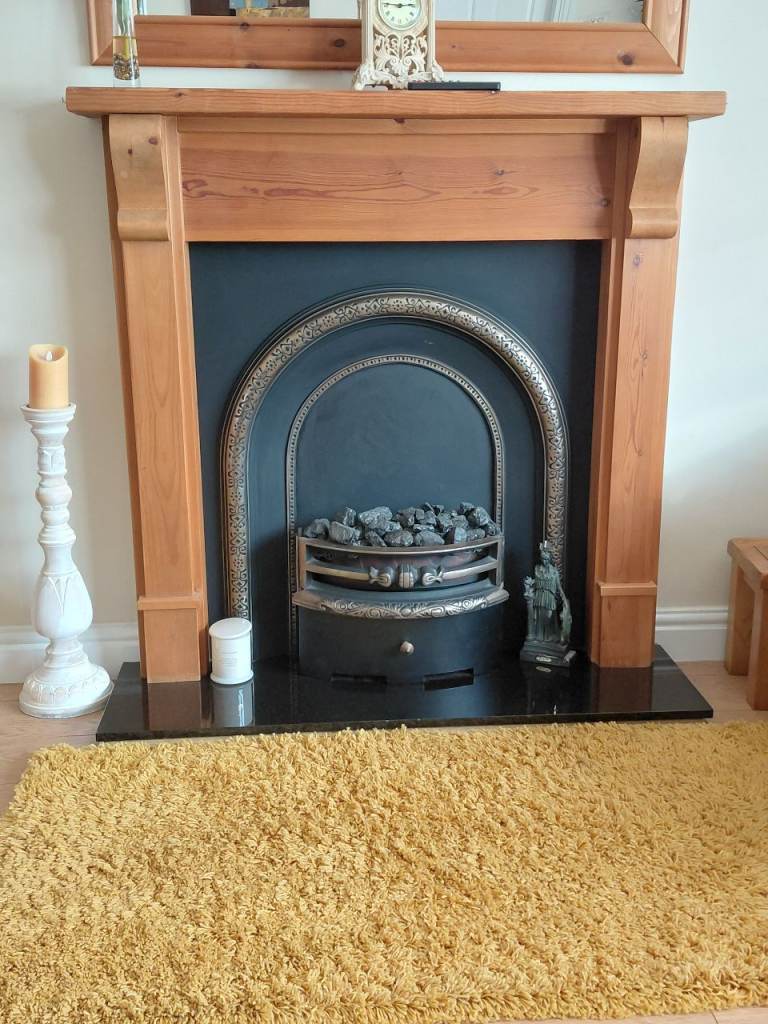 Pine Fireplace Surround with Cast Iron Insert and Electric Fire