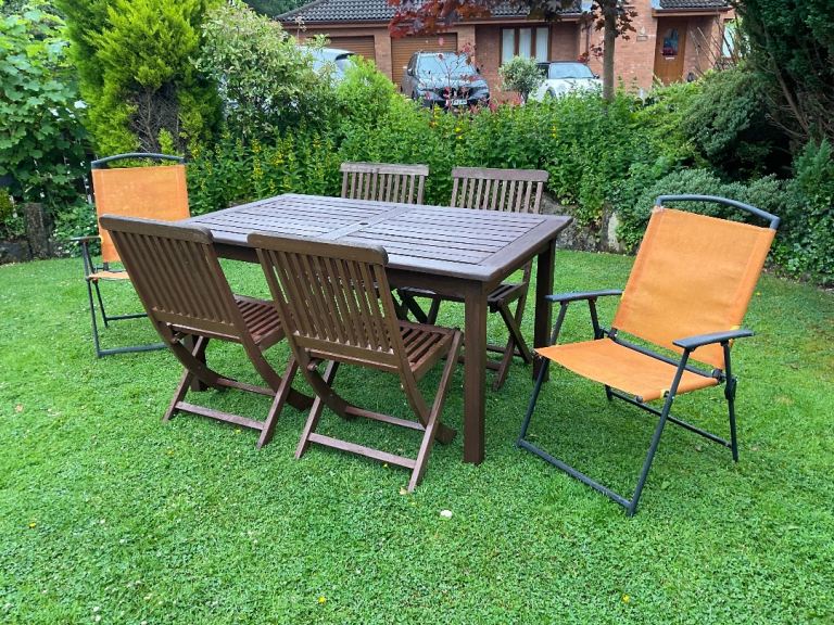 Garden Furniture. Hardwood Table + 4 Folding Chairs. Can Deliver. + 2 Spare Chairs. Good Condition 