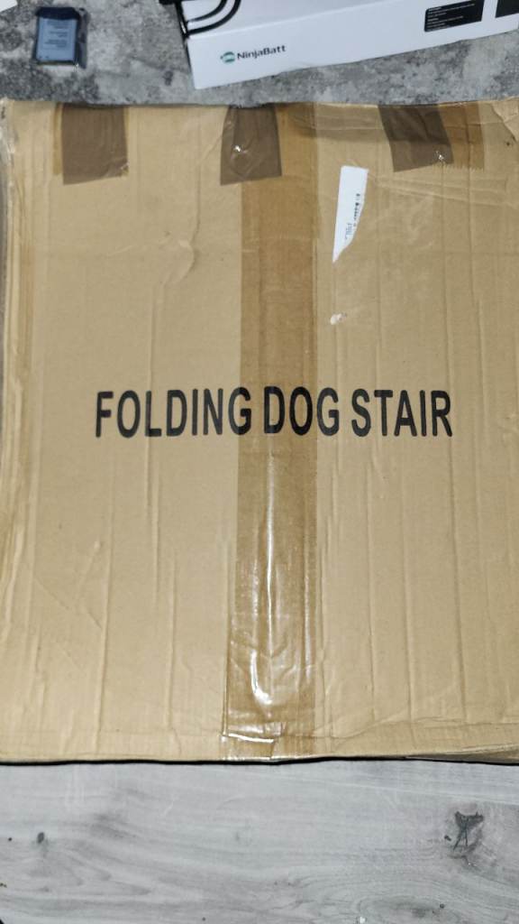Brand new folding dog stair opened but never assembled 