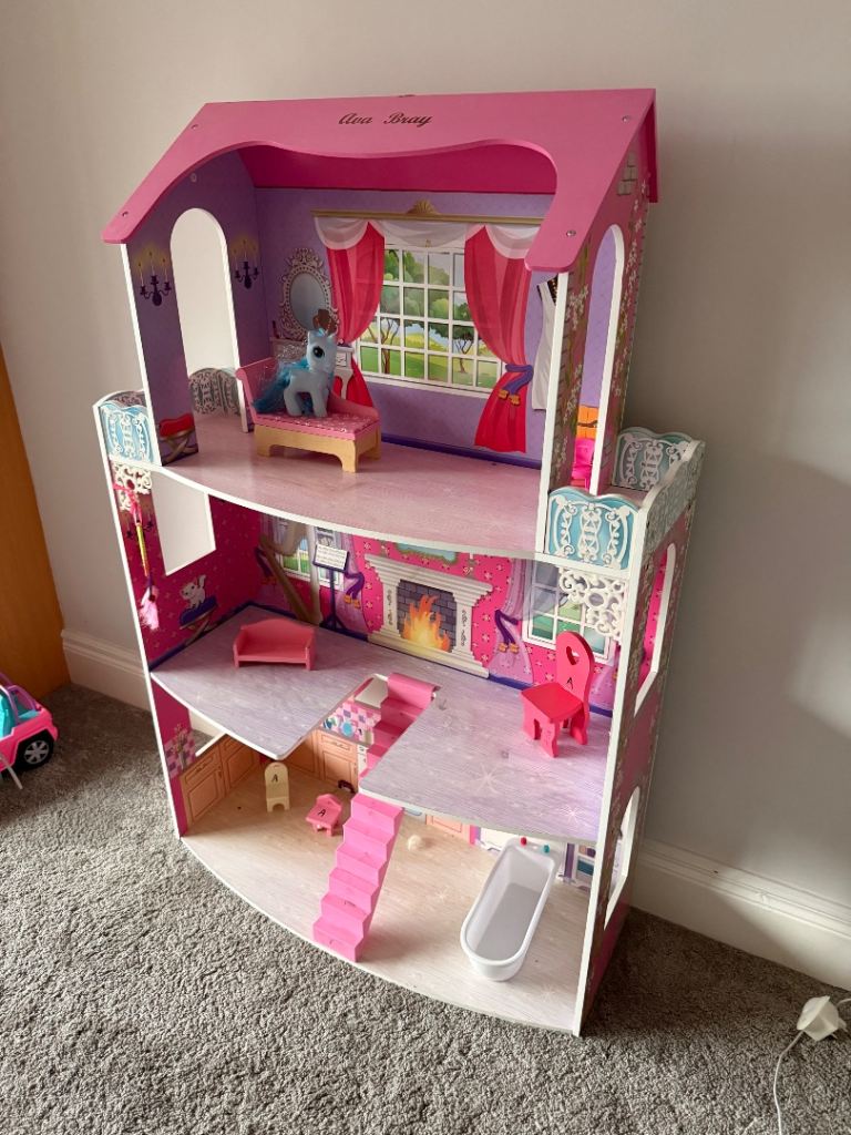 Lovely large open dolls house in pink 
