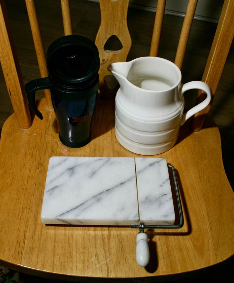 Marble Cheese Slicer, White Jug, and Black Travel Mug – Wall Mug Racks x 2. Good Condition
