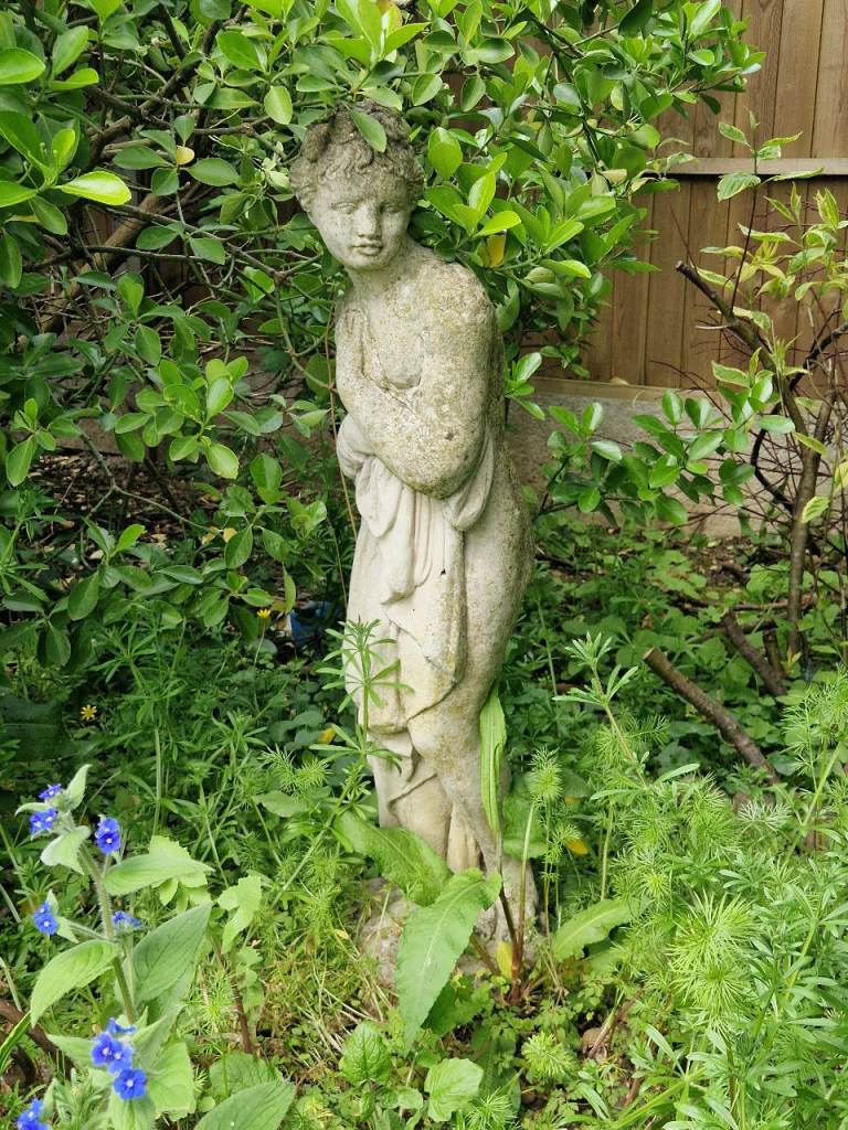 Weathered garden statue
