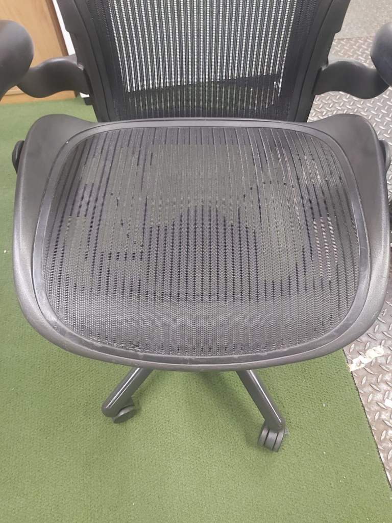 Herman Miller aeron size B with minor snag.
