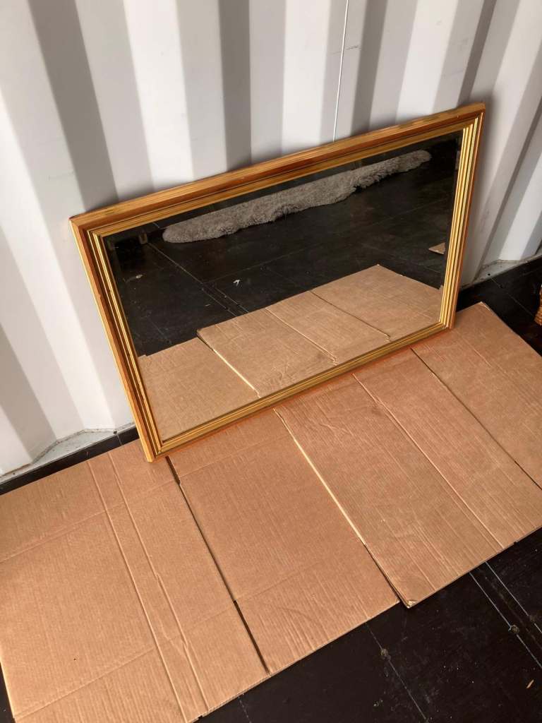 Gold framed wall mirror measuring approx 95cm x 65cm - £80