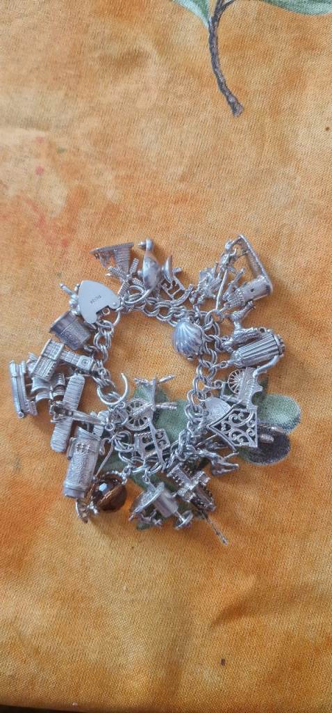 image for soiled silver charm bracelet 