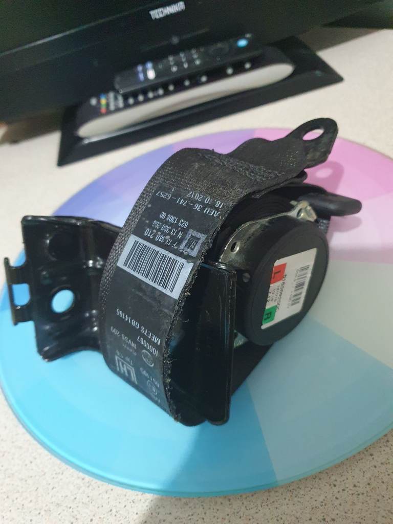 Astra J rear passenger side seat belt.