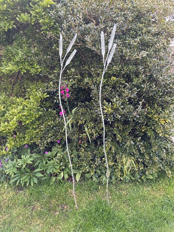 Two garden ornament silver coloured metal leaves stakes - £15 each or £20 both