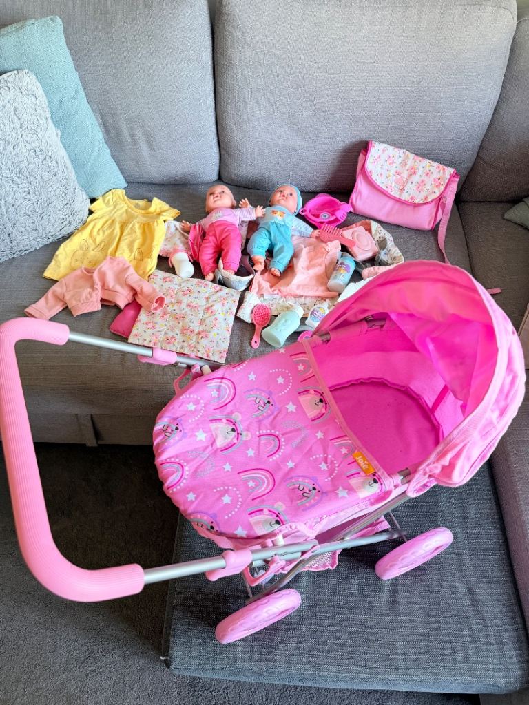 Joie baby doll pram with two babies, full change set and baby carrier 