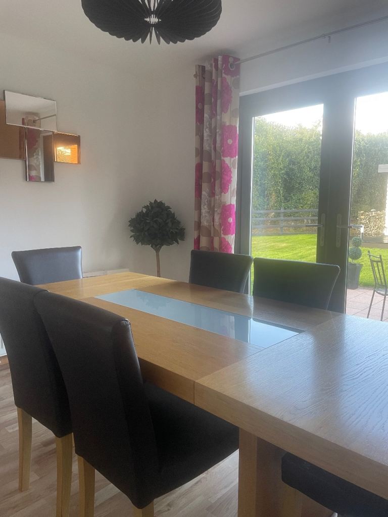 Dining Room Table and Six Brown Faux Leather Chairs