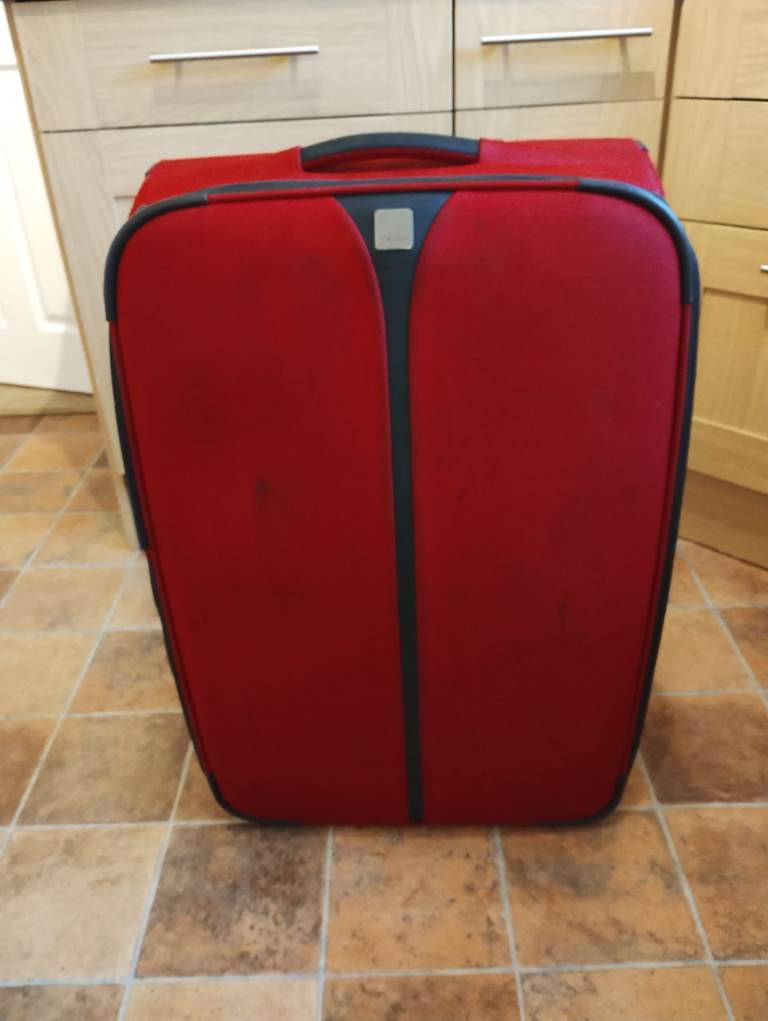 Tripp suitcase extra large dark red black trim extendable & very lightweight. Freeland 