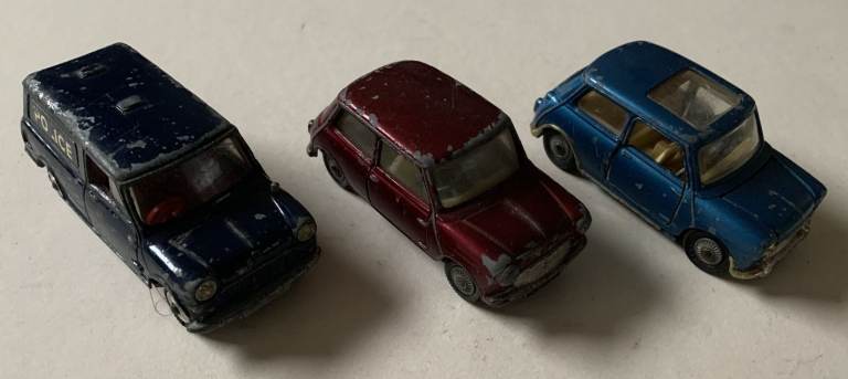 Three vintage Corgi diecast toy cars from 1960s 70s