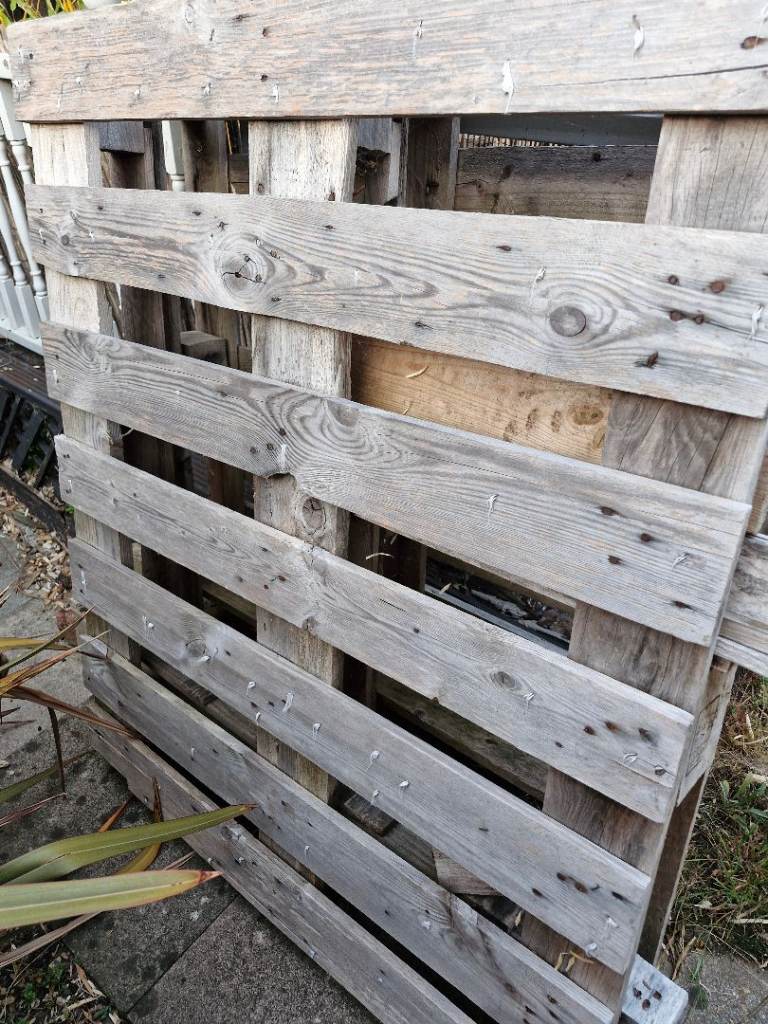 2 pallets, 1 intact,  and 1 partially broken