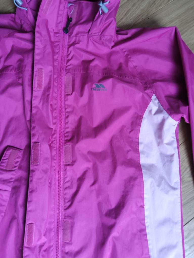 Trespass size L womens waterproof jacket, fold away hood bright pink, lighter panel detail. As new