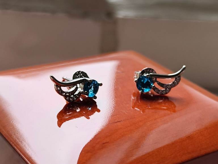 Silver Brilliant Cut Wing Blue Stone Earrings 