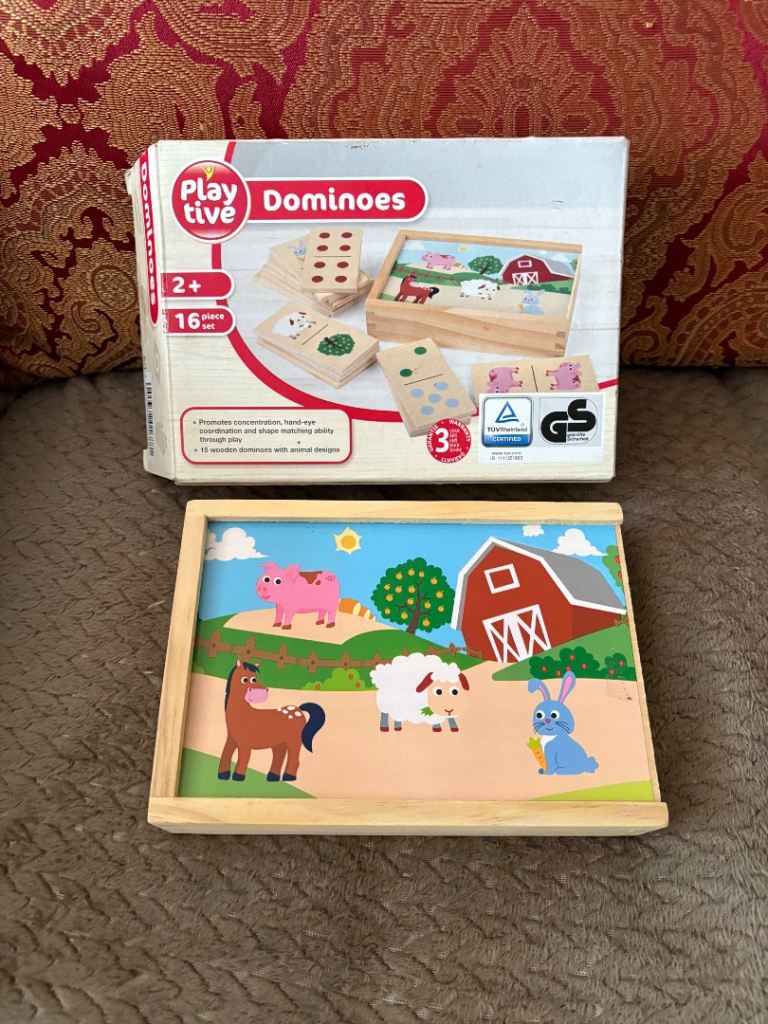 Boxed Double sided farm animal dominoes.