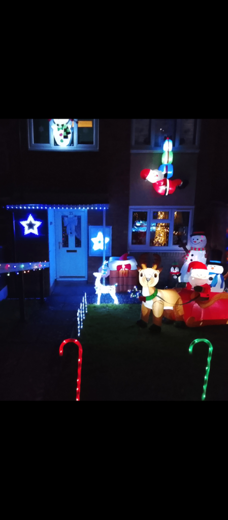 large collection of outdoor Christmas decoration including inflatables 