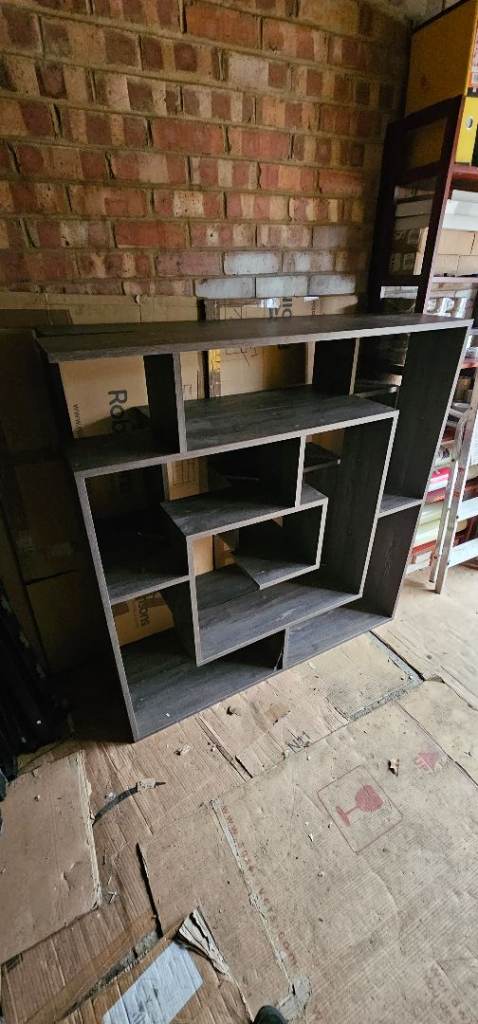 S-shaped Geometric Bookcase with A Dark Wood-grain Finish.