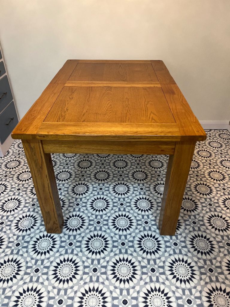 image for Solid oak extending dining table 