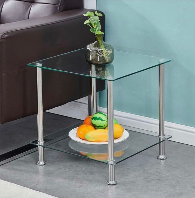 Modern glass side table with metal legs.