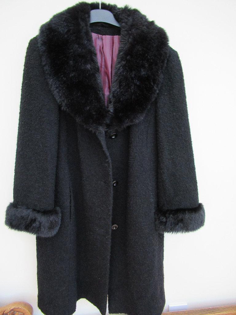 Ladies 'Marks & Spencer' black Astrakhan effect coat with a faux fur collar and cuffs. Size 18. 