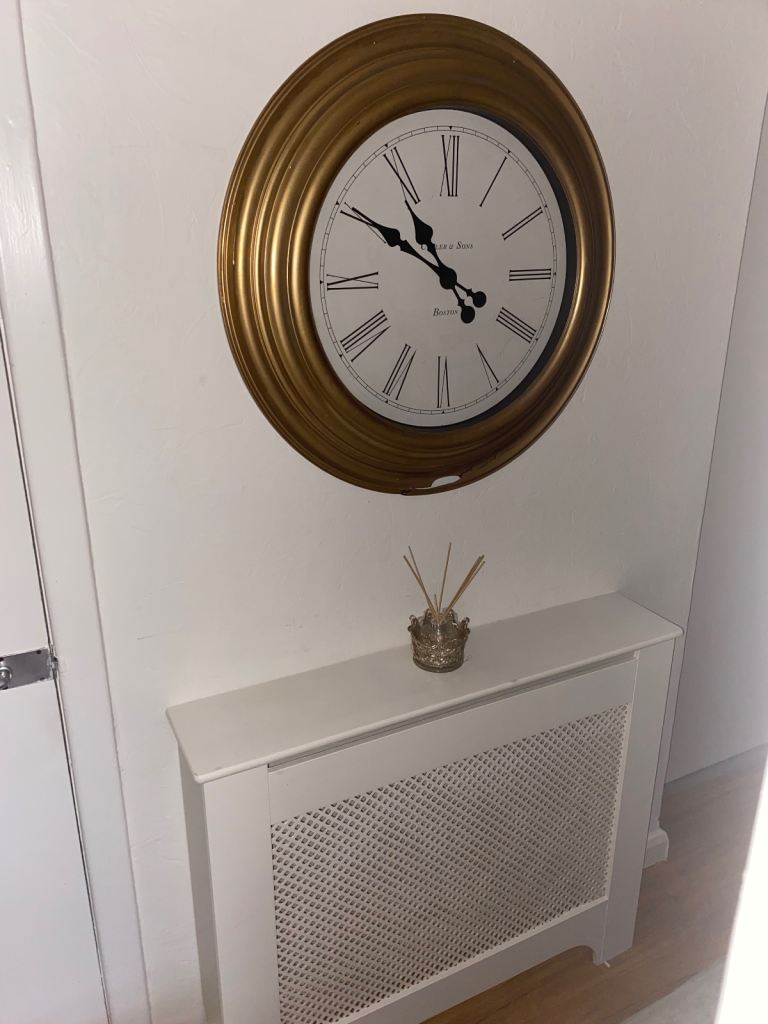 Radiator cover and large clock 