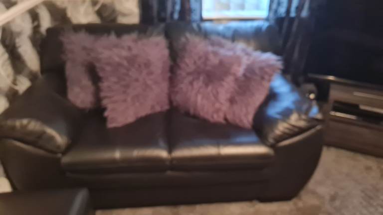 Black leather 2 seater sofa