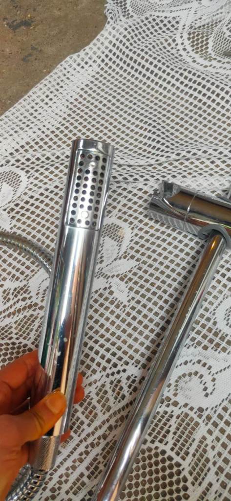 Shower rail with shower head and hose