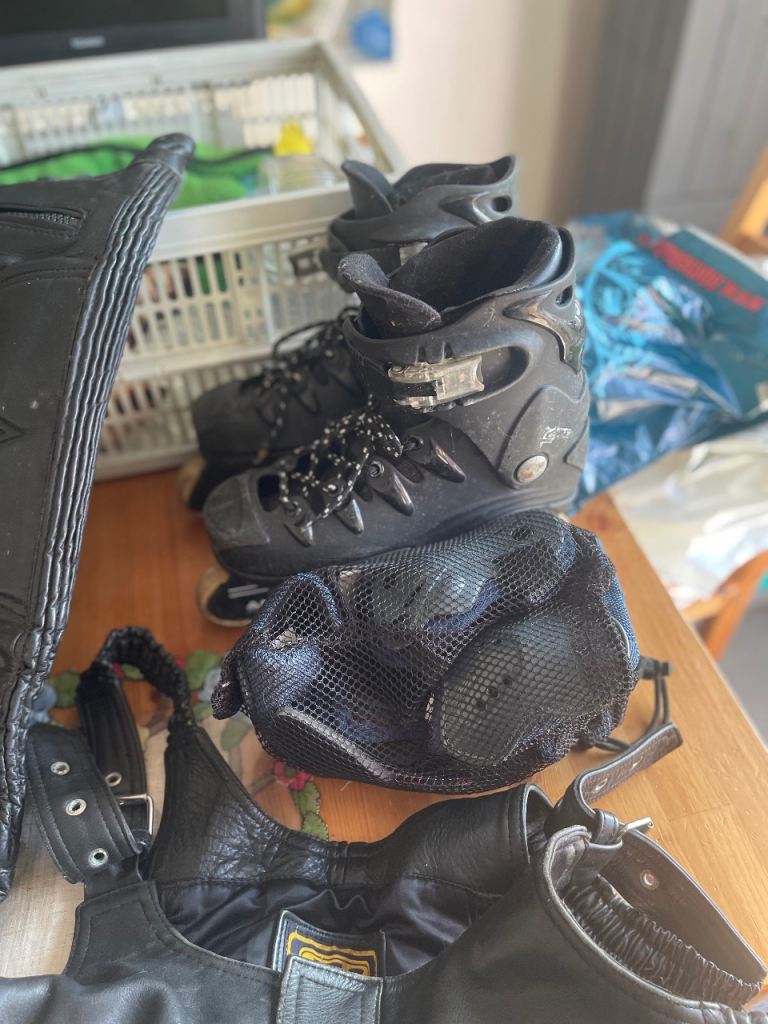 Roller boots with pads and leathers.
