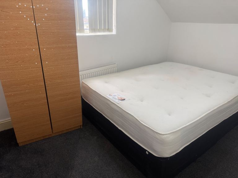 Room with attached toilet and 