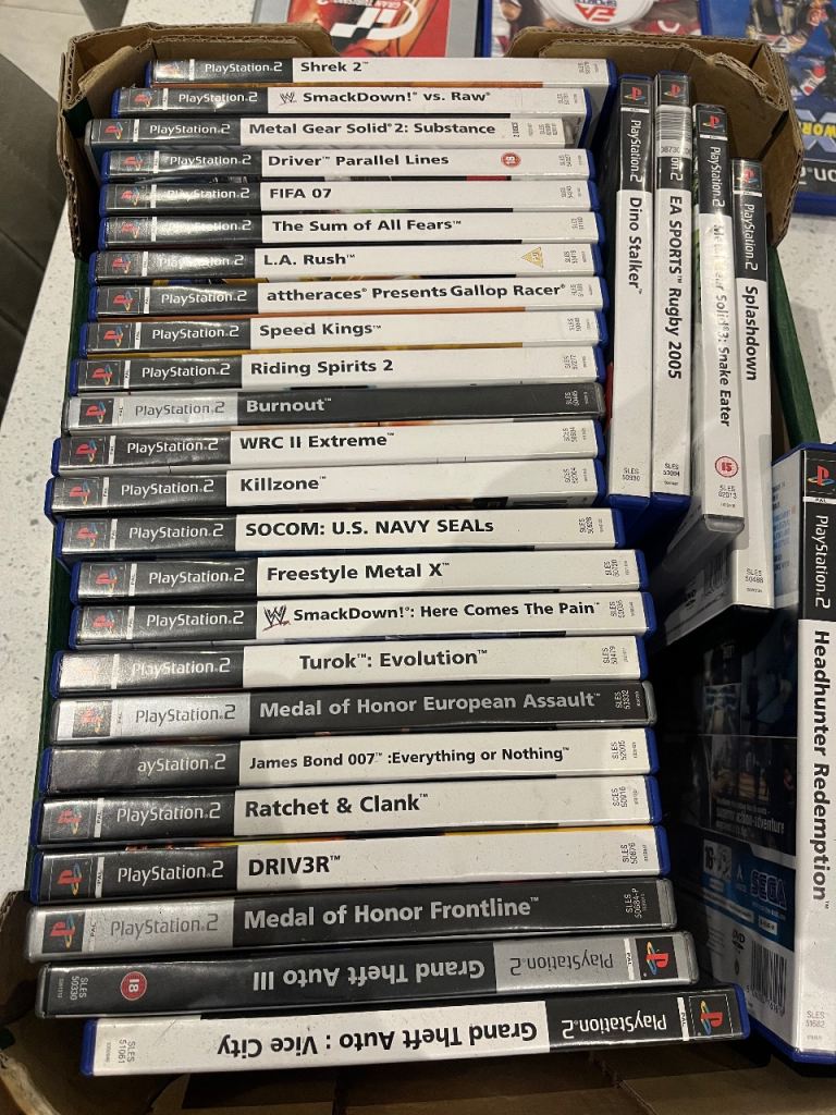 PlayStation 2 with games and microphones 
