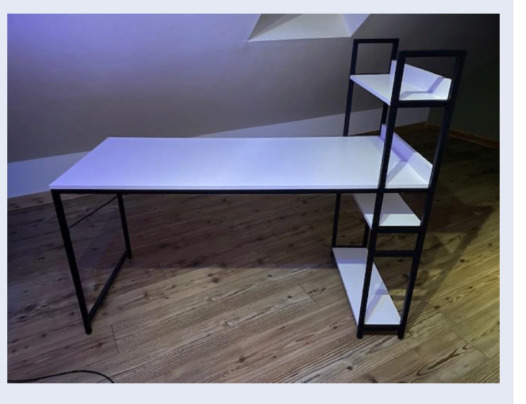 White desk with black mental frame