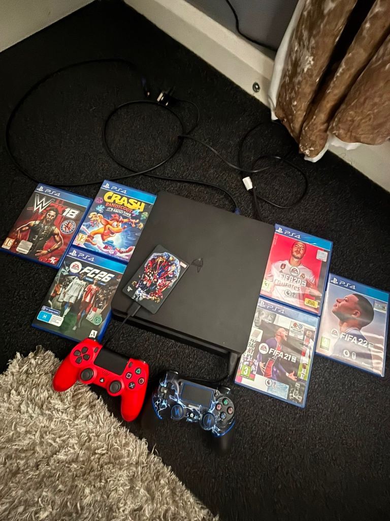 PS4 Console with Two Controllers & 6 Games – Good Condition