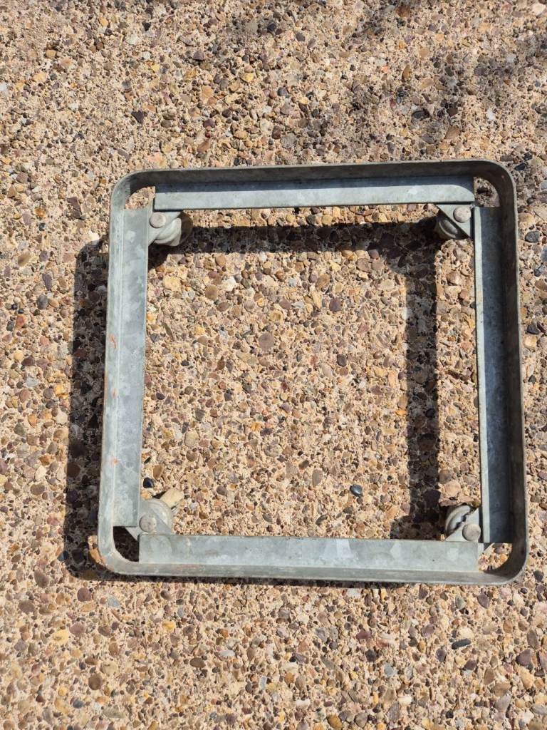 Strong metal frame with casters on - external dimensions are 42cm x 42cm x 9.5cm