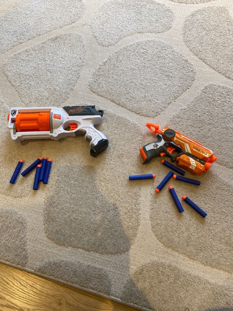 Two Nerf guns with foam bullets 