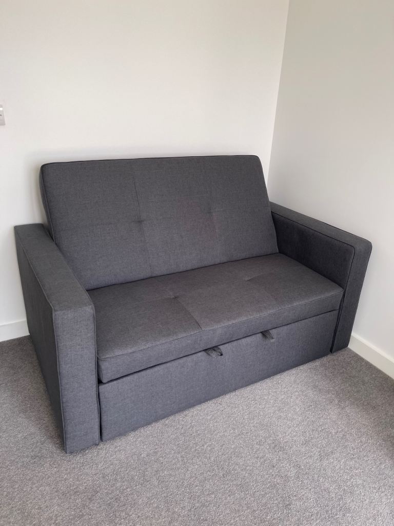 As-New Bevers 2 seater fold out sofa bed. Grey Fabric - immaculate Condition