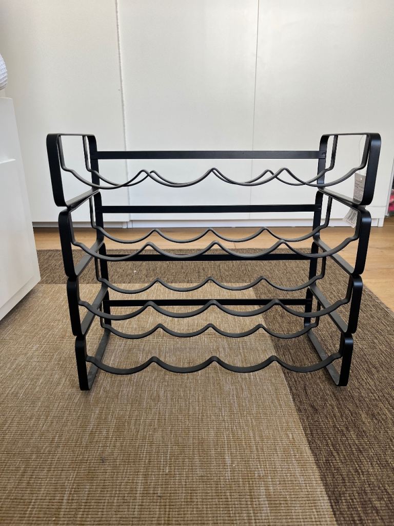 Unused Stackable wine racks in black steel