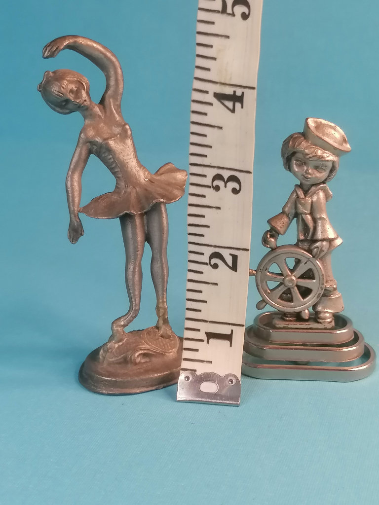 2x home decor  small Sculptures :ballerina model and young boy with ship wheel. 