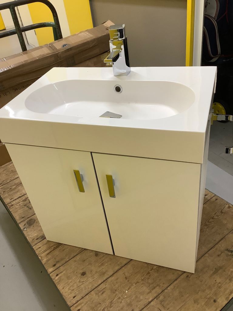White wall hanging vanity bathroom sink and tap