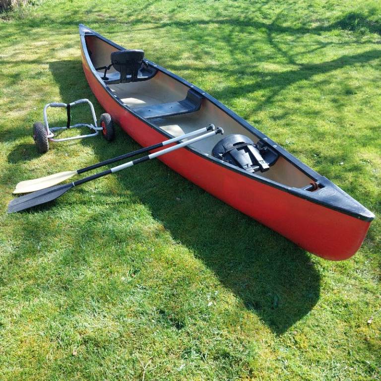 Lovely red 3 seater Old Town canoe