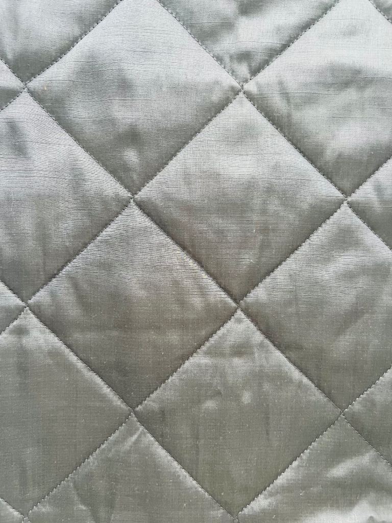 Grey quilted throw