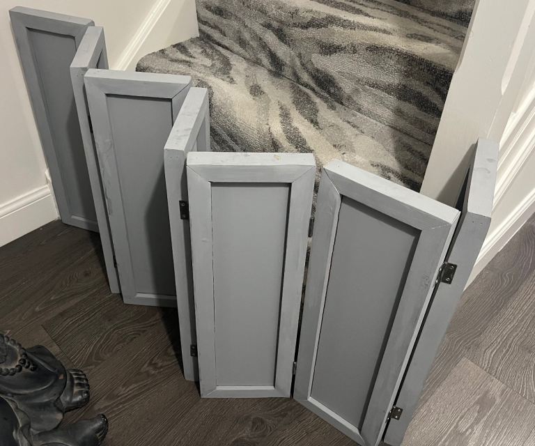 Grey wooden pet barrier, baby gate