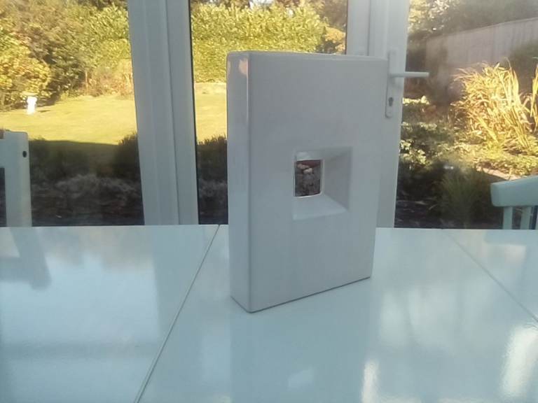 Attractive white square ceramic vase ornament.